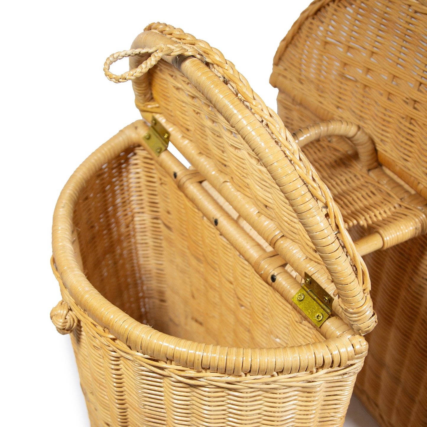 Handwoven bike basket with the lid up so you can see inside. Shot in a studio with a white background